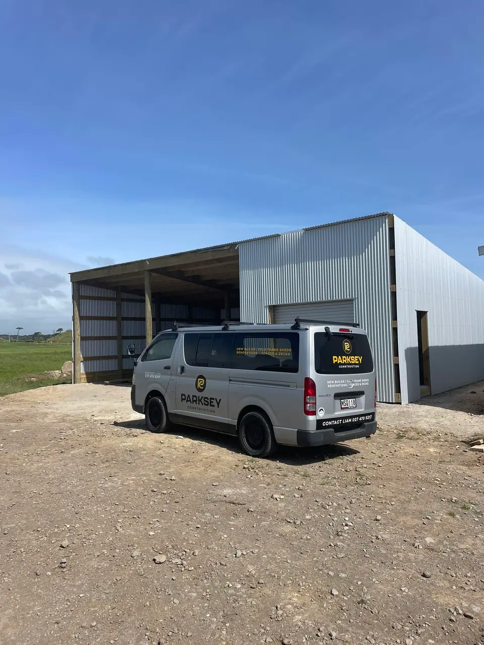 Completed shed with the Parksey Construction van parked outside