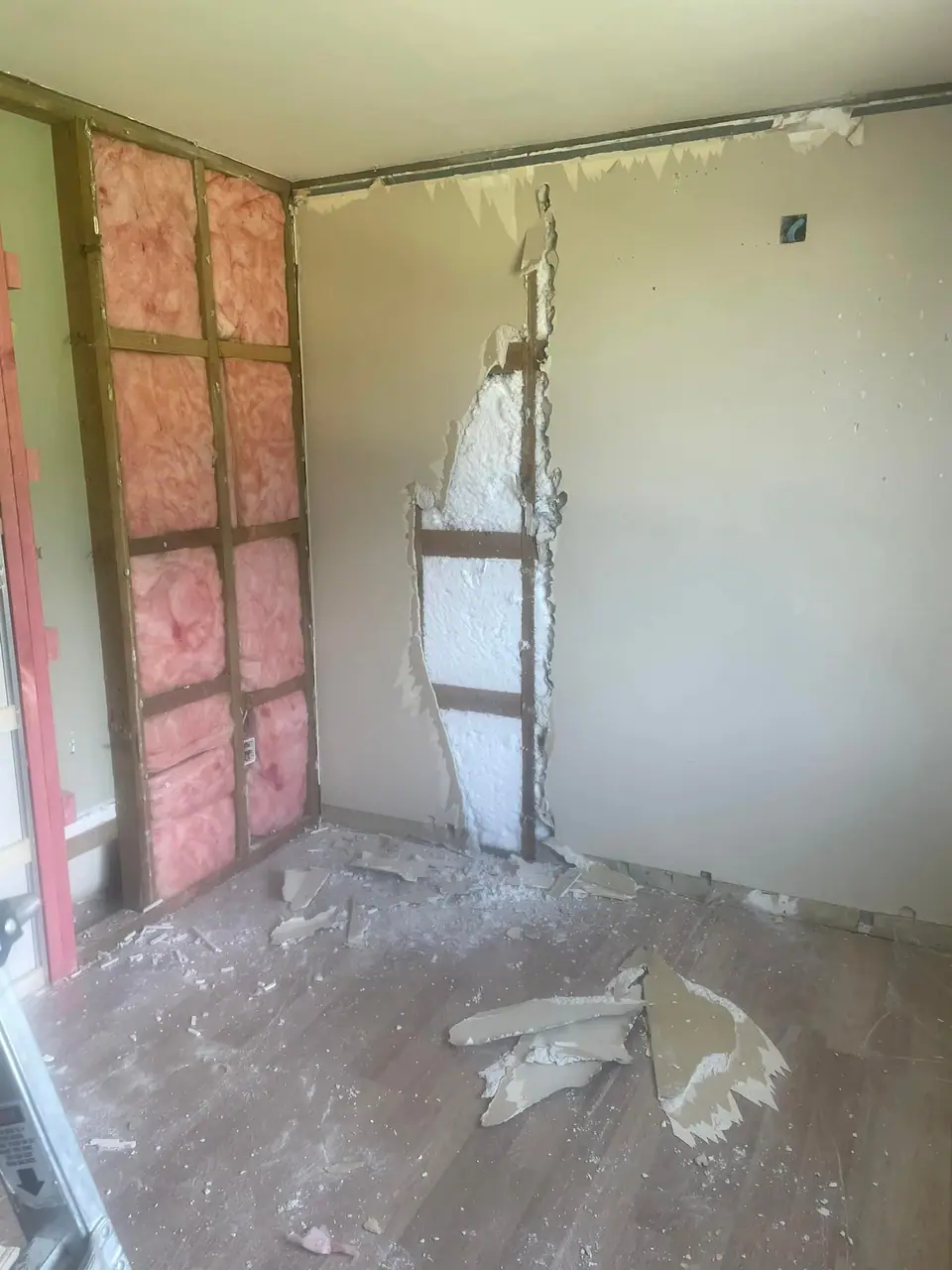 Old Gib removed and insulation exposed during an interior renovation