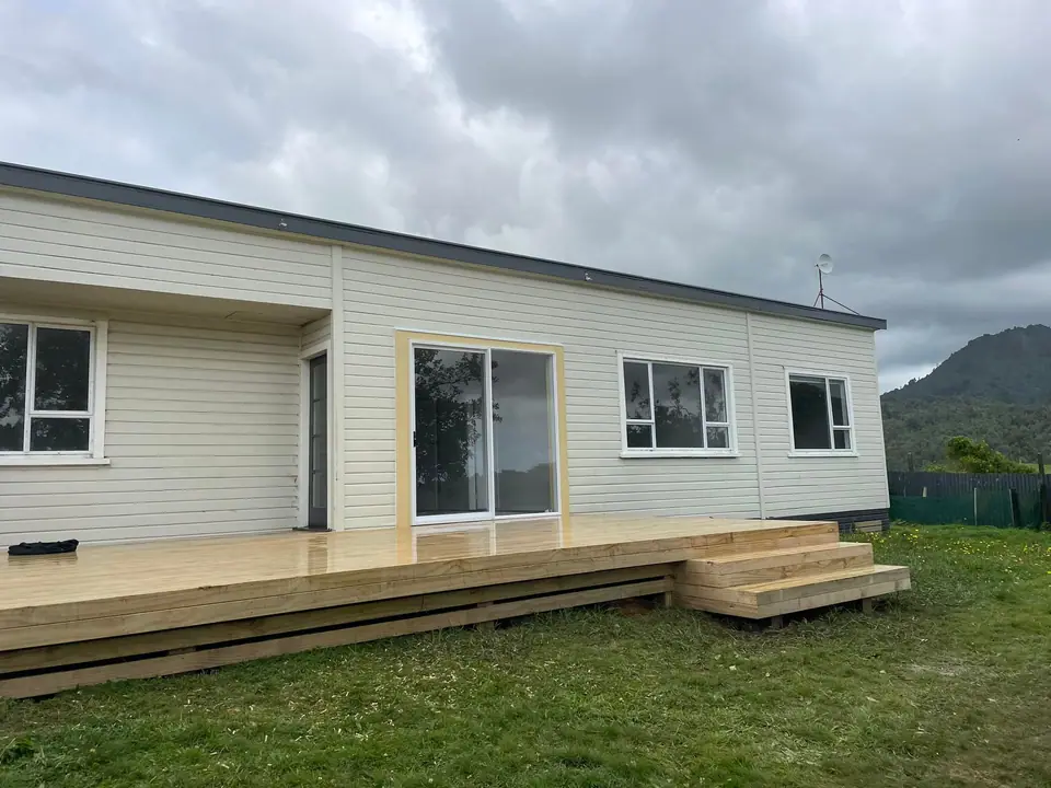 Home with a new timber deck and steps after renovation