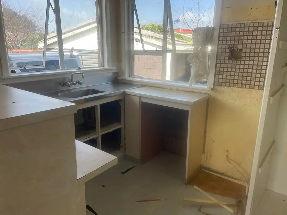 Old kitchen partly stripped out at the start of a renovation