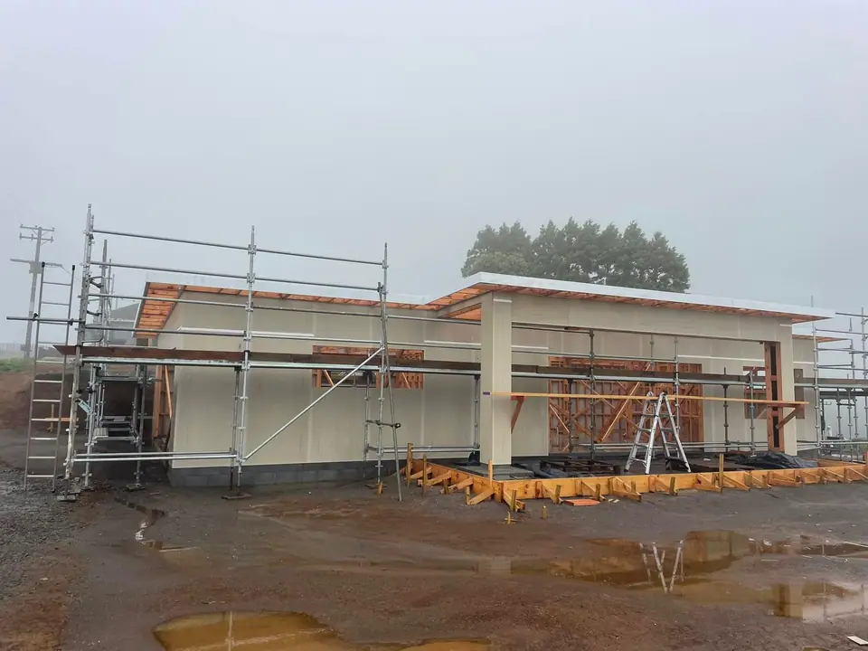 New home at cladding stage with scaffolding in place