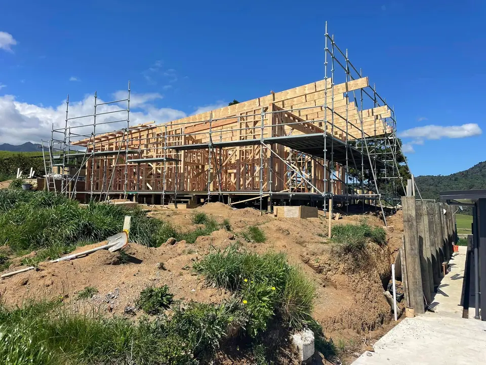 New build framing and scaffolding on a sloping site