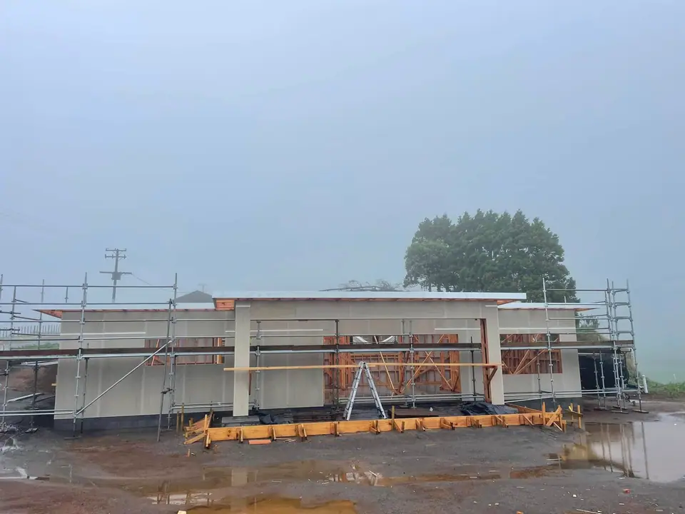 New build with scaffolding and cladding underway
