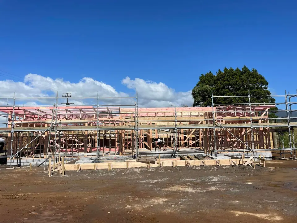 Wall frames and roof trusses on a new build site