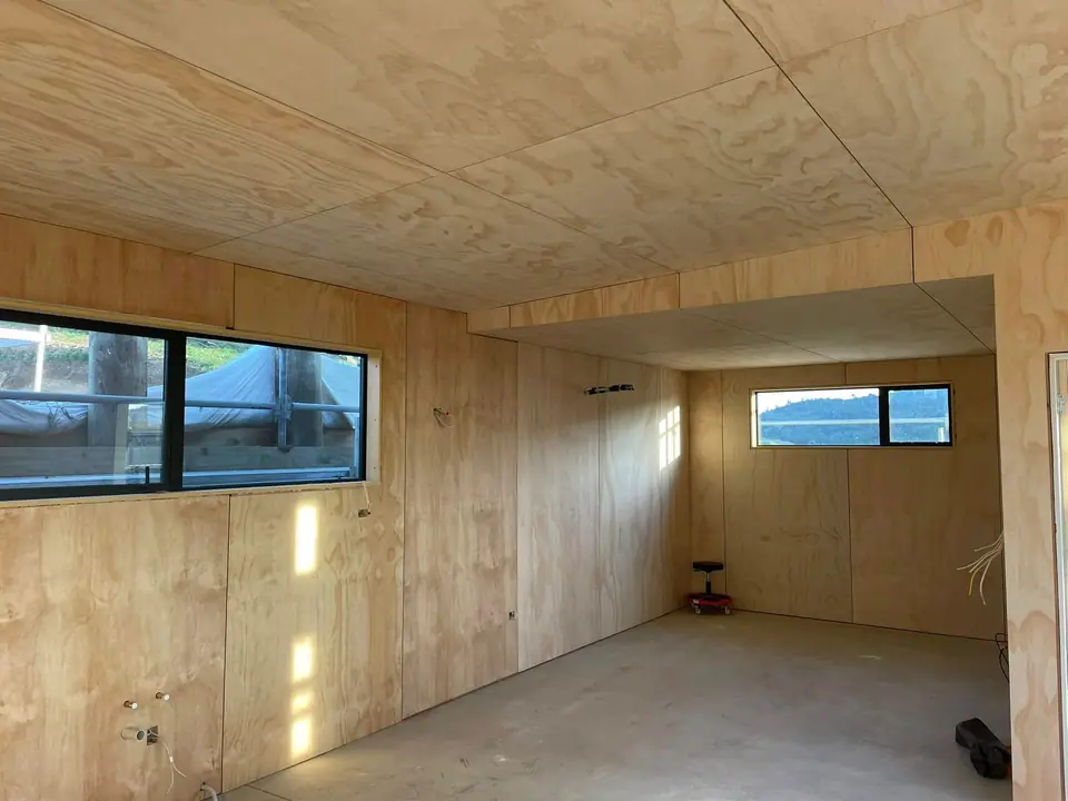 Interior walls and ceiling lined in plywood