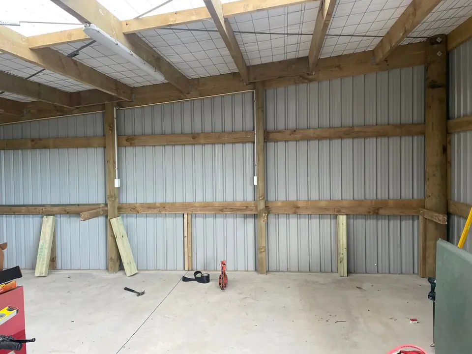 Pole shed walls clad in corrugated iron