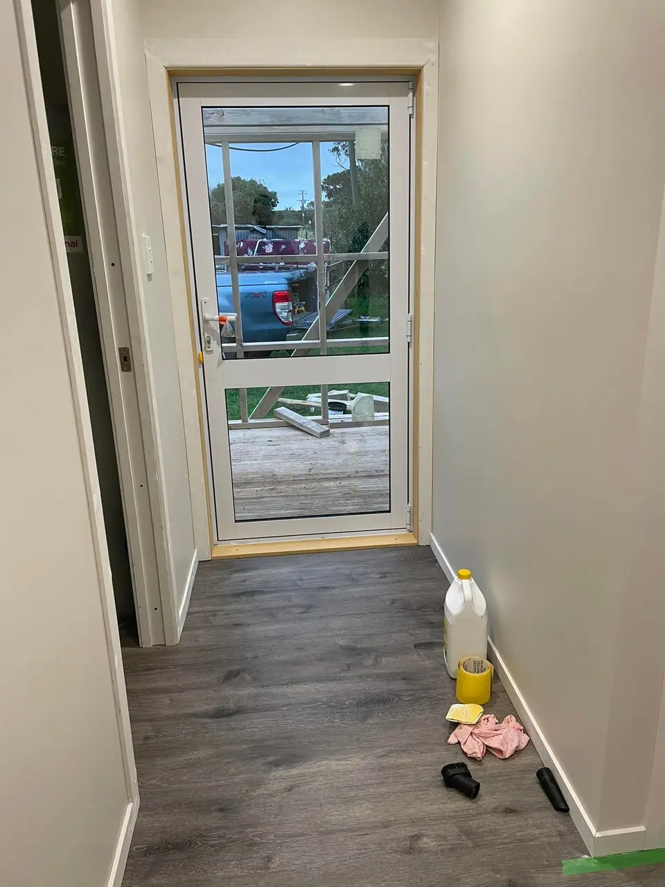 Renovated entry hall with new door and flooring