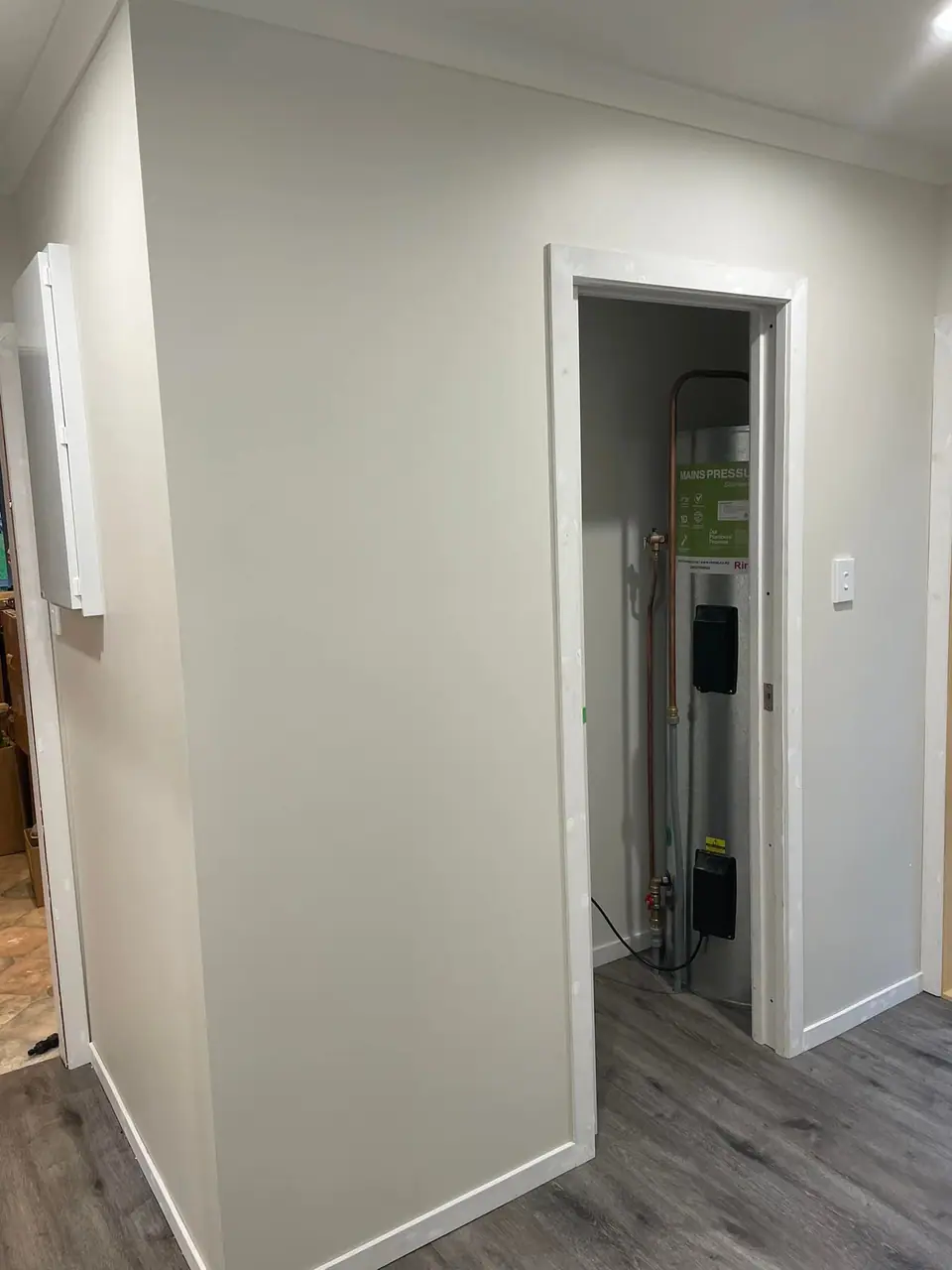 Hallway with new doors, trims and flooring after renovation