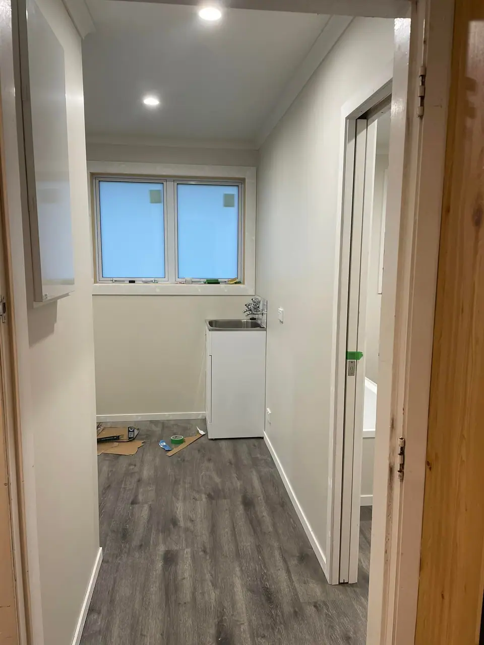 Renovated hallway looking through to the laundry