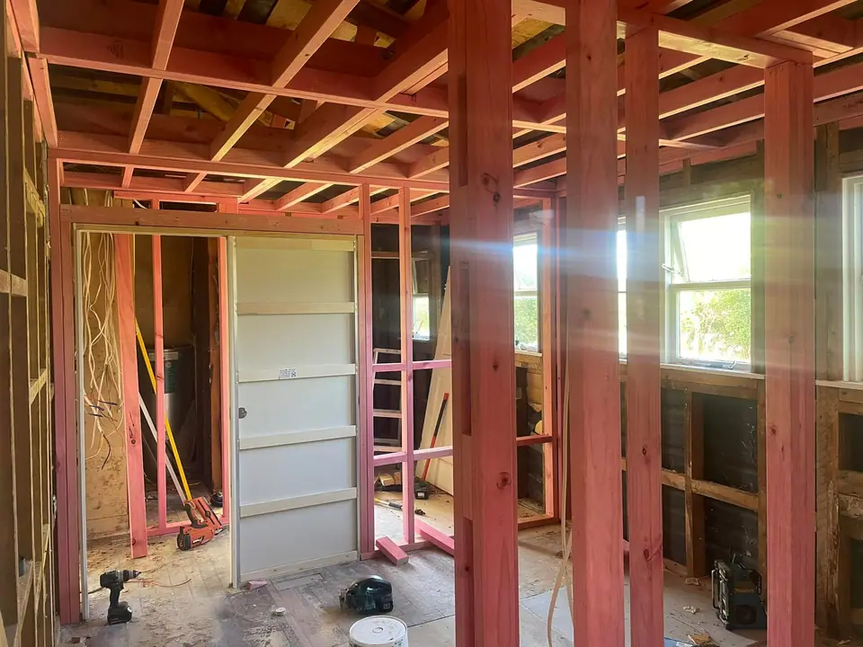 New wall and ceiling framing inside a home under renovation