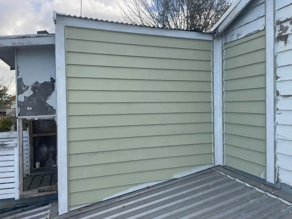 New weatherboard cladding fitted during an exterior renovation